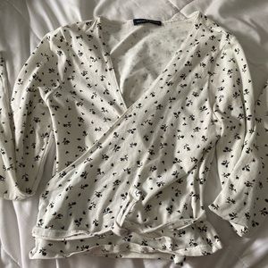 A white wrap shirt.
